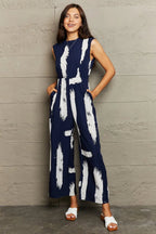 Perfee Printed Round Neck Cutout Jumpsuit with Pockets - Charmdeals